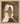 Gabriel Heaton painting of Jesus Christ in white robes standing in the doorway of the empty tomb looking out into bright light beyond the stone archway
