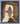Gabriel Heaton painting of Jesus Christ in white robes standing in the doorway of the empty tomb looking out into bright light beyond the stone archway