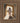 Gabriel Heaton painting of Jesus Christ in white robes standing in the doorway of the empty tomb looking out into bright light beyond the stone archway