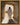 Gabriel Heaton painting of Jesus Christ in white robes standing in the doorway of the empty tomb looking out into bright light beyond the stone archway