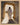 Gabriel Heaton painting of Jesus Christ in white robes standing in the doorway of the empty tomb looking out into bright light beyond the stone archway