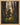 Gabriel Heaton painting of Moroni kneeling in prayer in a forest with his sword planted in the ground and rays of light filtering through the trees