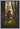 Gabriel Heaton painting of Moroni kneeling in prayer in a forest with his sword planted in the ground and rays of light filtering through the trees