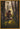 Gabriel Heaton painting of Moroni kneeling in prayer in a forest with his sword planted in the ground and rays of light filtering through the trees