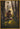 Gabriel Heaton painting of Moroni kneeling in prayer in a forest with his sword planted in the ground and rays of light filtering through the trees