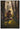 Gabriel Heaton painting of Moroni kneeling in prayer in a forest with his sword planted in the ground and rays of light filtering through the trees