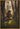 Gabriel Heaton painting of Moroni kneeling in prayer in a forest with his sword planted in the ground and rays of light filtering through the trees