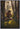 Gabriel Heaton painting of Moroni kneeling in prayer in a forest with his sword planted in the ground and rays of light filtering through the trees