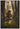 Gabriel Heaton painting of Moroni kneeling in prayer in a forest with his sword planted in the ground and rays of light filtering through the trees