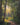 Gabriel Heaton painting of a sunlit forest path with golden light streaming through tall trees creating a luminous heavenly atmosphere