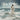 Gabriel Heaton painting of Jesus Christ standing firm in stormy ocean waves holding a woman in white robes as waves crash around them