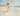 Gabriel Heaton painting of Jesus Christ in white robes carrying a young woman along a sandy beach with ocean waves