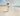 Gabriel Heaton painting of Jesus Christ in white robes carrying a young woman along a sandy beach with ocean waves