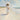 Gabriel Heaton painting of Jesus Christ in white robes carrying a young woman along a sandy beach with ocean waves