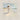 Gabriel Heaton painting of Jesus Christ in white robes carrying a young woman along a sandy beach with ocean waves
