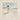 Gabriel Heaton painting of Jesus Christ in white robes carrying a young woman along a sandy beach with ocean waves