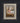 Gabriel Heaton painting of the baby Jesus sleeping in a golden straw manger with a white lamb resting beside him in soft warm light