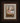 Gabriel Heaton painting of the baby Jesus sleeping in a golden straw manger with a white lamb resting beside him in soft warm light