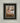 Gabriel Heaton painting of the baby Jesus sleeping in a golden straw manger with a white lamb resting beside him in soft warm light