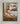 Gabriel Heaton painting of the baby Jesus sleeping in a golden straw manger with a white lamb resting beside him in soft warm light