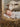 Gabriel Heaton painting of the baby Jesus sleeping in a golden straw manger with a white lamb resting beside him in soft warm light
