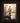 Gabriel Heaton painting of Jesus Christ seen from behind walking into brilliant white light reflected in calm water surrounded by dramatic clouds