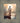 Gabriel Heaton painting of Jesus Christ seen from behind walking into brilliant white light reflected in calm water surrounded by dramatic clouds