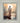 Gabriel Heaton painting of Jesus Christ seen from behind walking into brilliant white light reflected in calm water surrounded by dramatic clouds