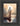 Gabriel Heaton painting of Jesus Christ seen from behind walking into brilliant white light reflected in calm water surrounded by dramatic clouds