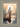 Gabriel Heaton painting of Jesus Christ seen from behind walking into brilliant white light reflected in calm water surrounded by dramatic clouds