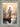 Gabriel Heaton painting of Jesus Christ seen from behind walking into brilliant white light reflected in calm water surrounded by dramatic clouds