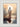 Gabriel Heaton painting of Jesus Christ seen from behind walking into brilliant white light reflected in calm water surrounded by dramatic clouds