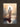 Gabriel Heaton painting of Jesus Christ seen from behind walking into brilliant white light reflected in calm water surrounded by dramatic clouds