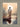 Gabriel Heaton painting of Jesus Christ seen from behind walking into brilliant white light reflected in calm water surrounded by dramatic clouds