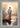 Gabriel Heaton painting of Jesus Christ seen from behind walking into brilliant white light reflected in calm water surrounded by dramatic clouds