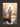 Gabriel Heaton painting of Jesus Christ seen from behind walking into brilliant white light reflected in calm water surrounded by dramatic clouds