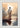 Gabriel Heaton painting of Jesus Christ seen from behind walking into brilliant white light reflected in calm water surrounded by dramatic clouds