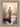 Gabriel Heaton painting of Jesus Christ seen from behind walking into brilliant white light reflected in calm water surrounded by dramatic clouds