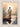 Gabriel Heaton painting of Jesus Christ seen from behind walking into brilliant white light reflected in calm water surrounded by dramatic clouds