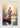 Gabriel Heaton painting of Jesus Christ seen from behind walking into brilliant white light reflected in calm water surrounded by dramatic clouds