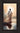 Gabriel Heaton painting of Jesus Christ seen from behind walking into brilliant white light reflected in calm water surrounded by dramatic clouds