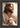 Gabriel Heaton's 'The Good Shepherd' Christian art of Jesus Christ looking to the side, holding a white lamb.