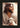 Gabriel Heaton's 'The Good Shepherd' Christian art of Jesus Christ looking to the side, holding a white lamb.