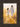Gabriel Heaton painting of Jesus Christ in white robes walking through a golden wheat field with two young girls following closely behind him
