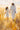 Gabriel Heaton painting of Jesus Christ in white robes walking through a golden wheat field with two young girls following closely behind him
